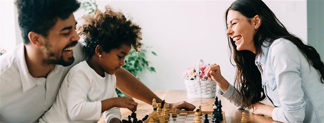 Family playing chess