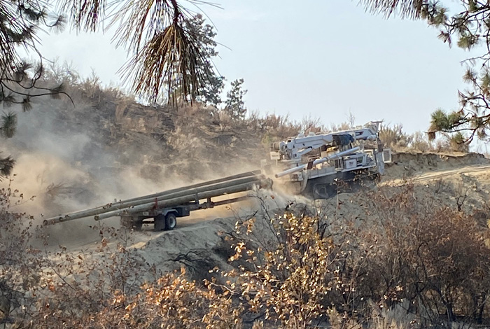 Truck on route to the Nk’Mip Creek wildfire with some of the replacement 32 electricity structures