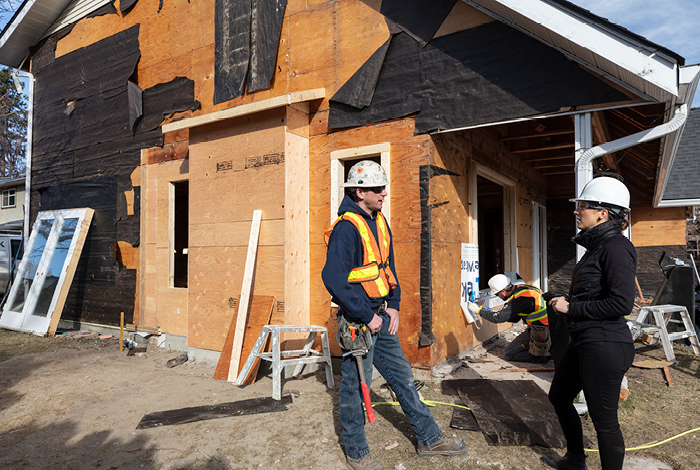 During photo of the house left exterior, windows being installed