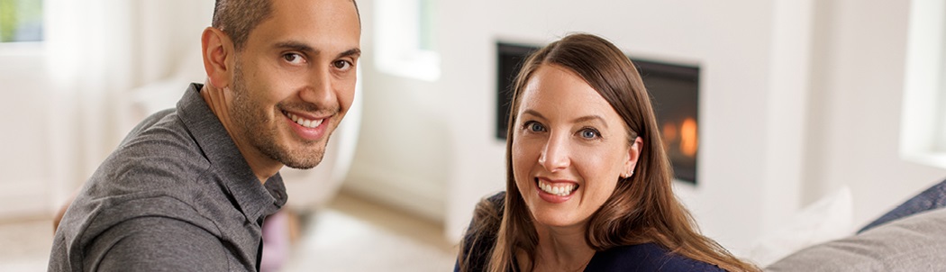 Colleen and Shane Sondermann sitting in their home