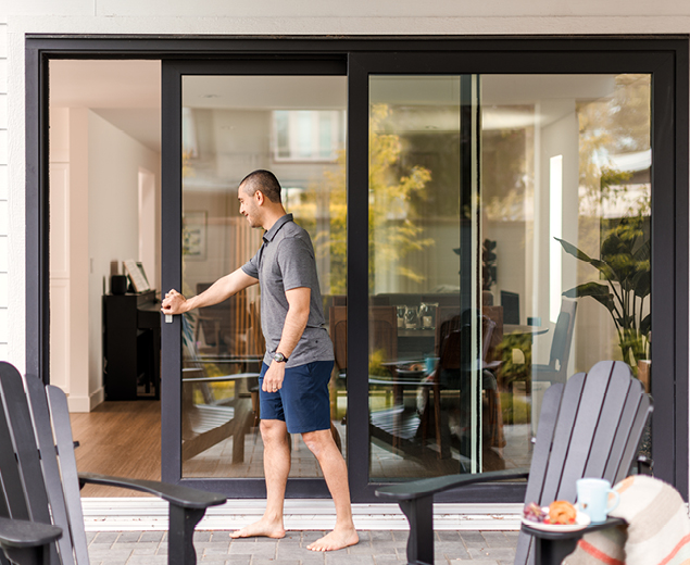 Shane opening the patio door