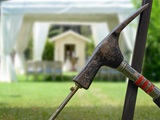 stake being driven into backyard