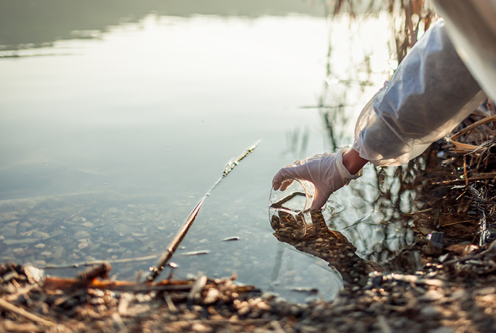 Person testing water samples