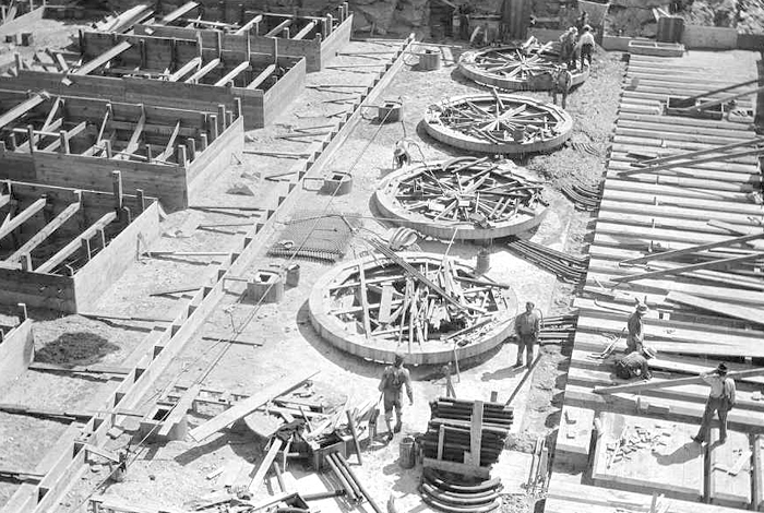 Dam’s turbines and rotors during the early construction years.