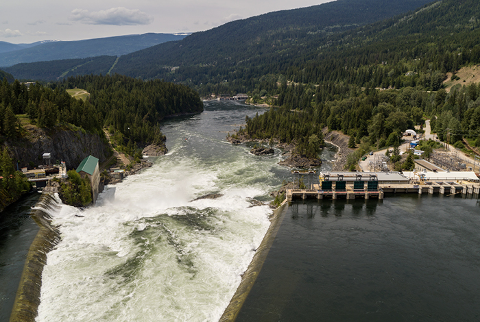 Aerial shot of the Upper Bonnington Dam with a large volume of water.