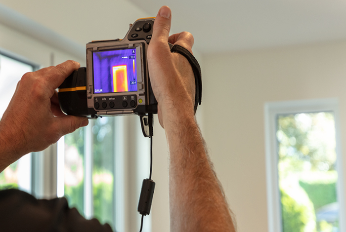 An energy advisor assessing a home’s energy efficiency