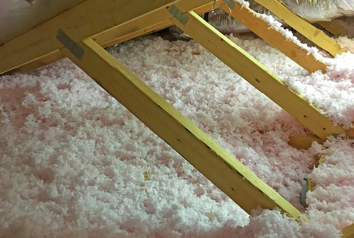 Close-up of loose fill insulation in an attic
