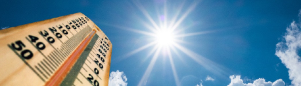 Thermometer in bright sun showing rising temperatures