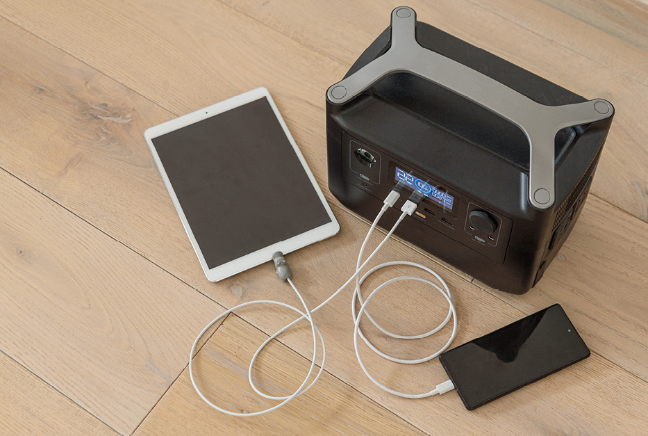 26-064-3-backup-power-blog-inline-a-press Devices plugged into a portable power station.