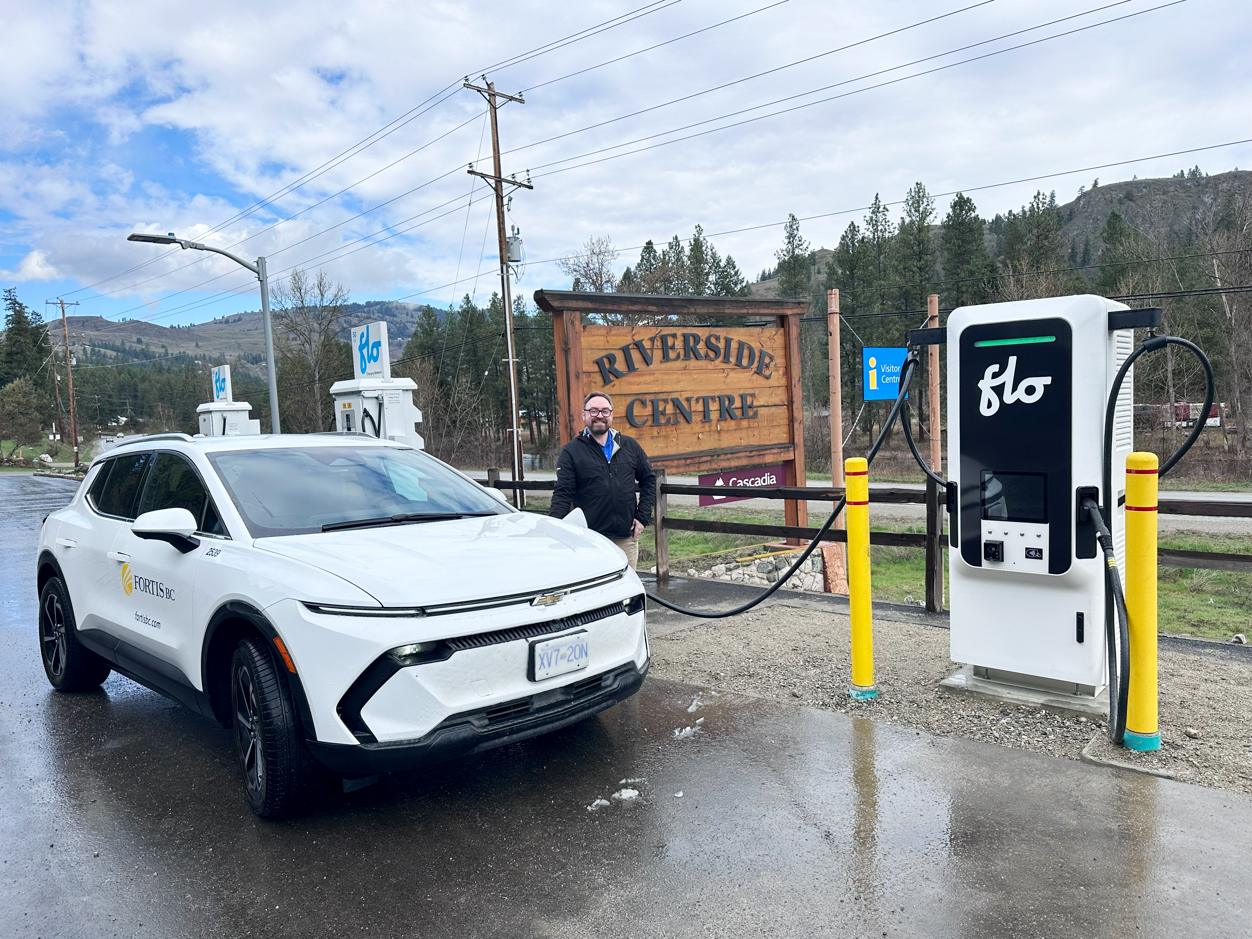 George Thompson, manager of EV infrastructure and investment, charges up at FortisBC’s new station in Rock Creek.