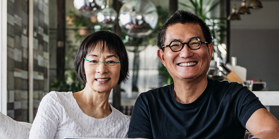 A woman wearing a white shirt next to a man wearing a black shirt.