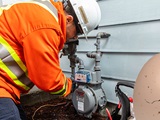 20-001.23.5 FortisBC customer service technician repairs a gas meter