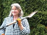 The writer in her backyard with a shovel.