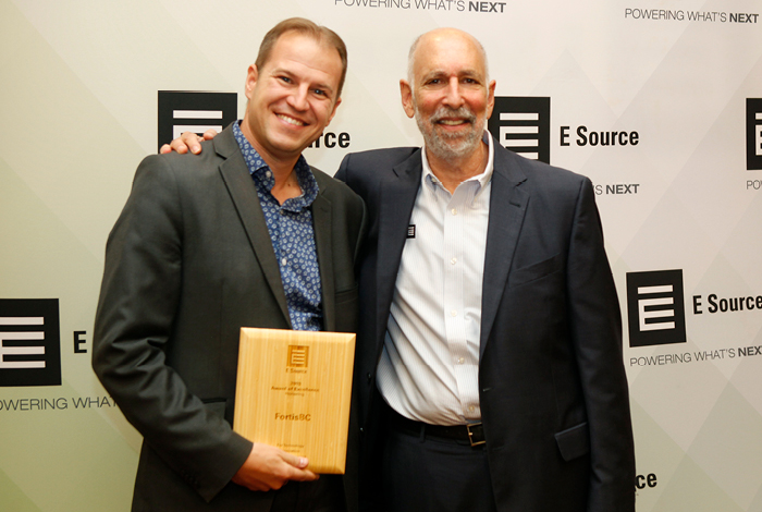 Jim Kobialko, Manager, Innovative Technologies, receiving the award from Wayne Greenburg, CEO of ESource. 