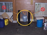 While protection posts in front of this meter are a good idea, the windows on either side are not. During renovations, do not add building openings such as windows or doors near a gas meter.