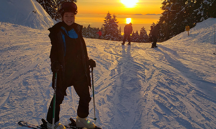 Jessica Skjeveland on the snowy skiing slopes of Seymour Mountain in the sunset, staying fit and healthy.