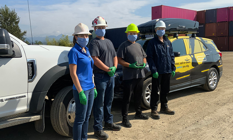 Michelle Petrusevich (left) and Ron Field (right) from FortisBC present our annual safe digging award to Dennis Tuokko (middle left) and Nermin Mujic (middle right) from LJE Underground Inc.